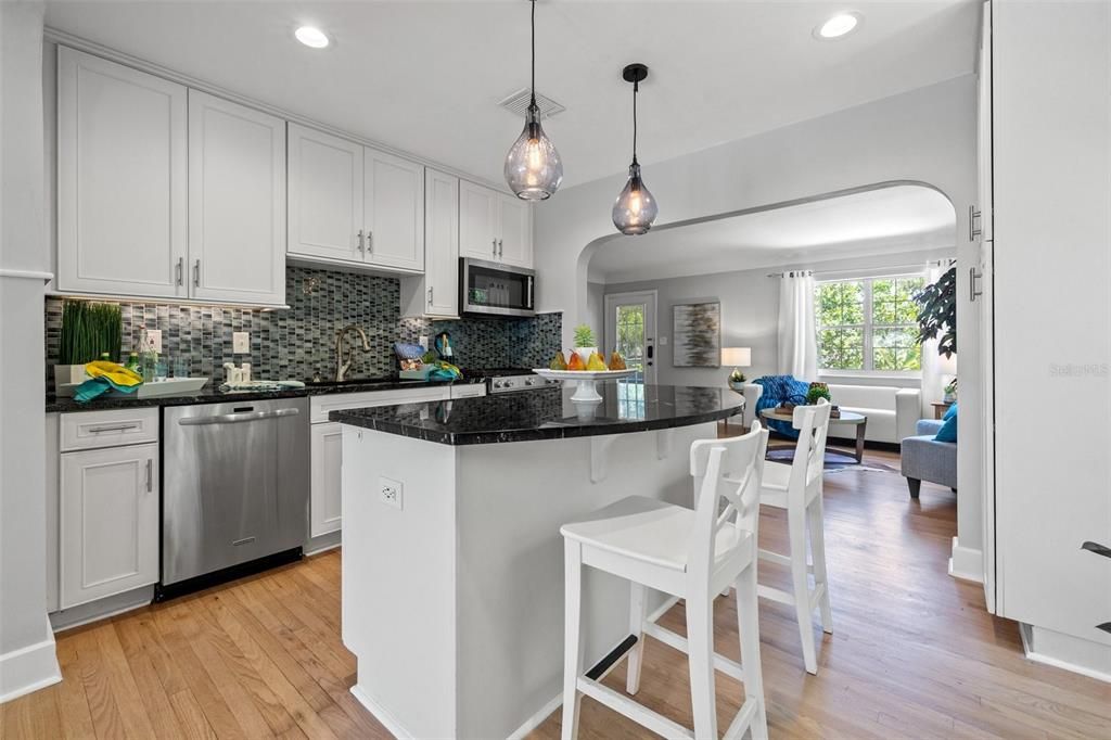 View of the kitchen and island looking towards the front on the house