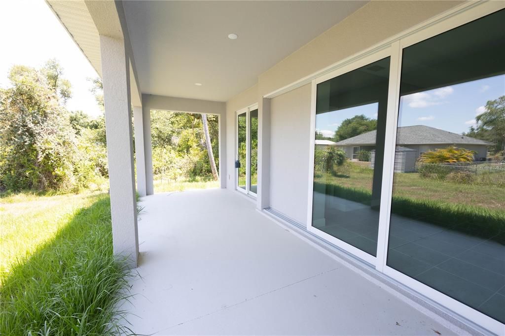 Extra large covered lanai for enjoying the outdoors and entertaining