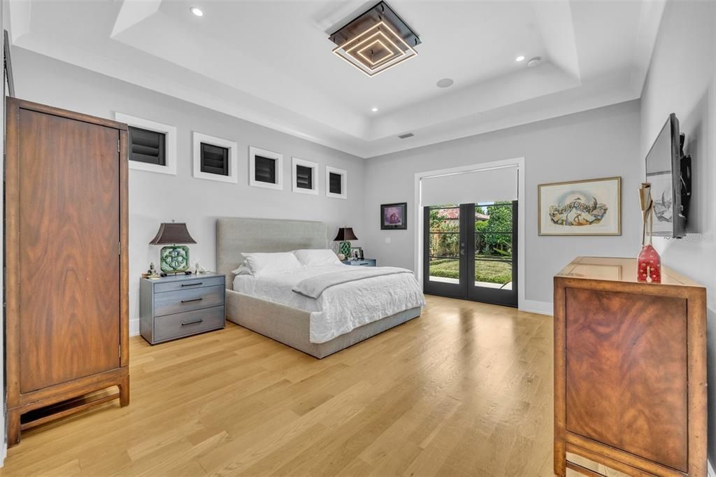 Primary suite with French doors to the pool