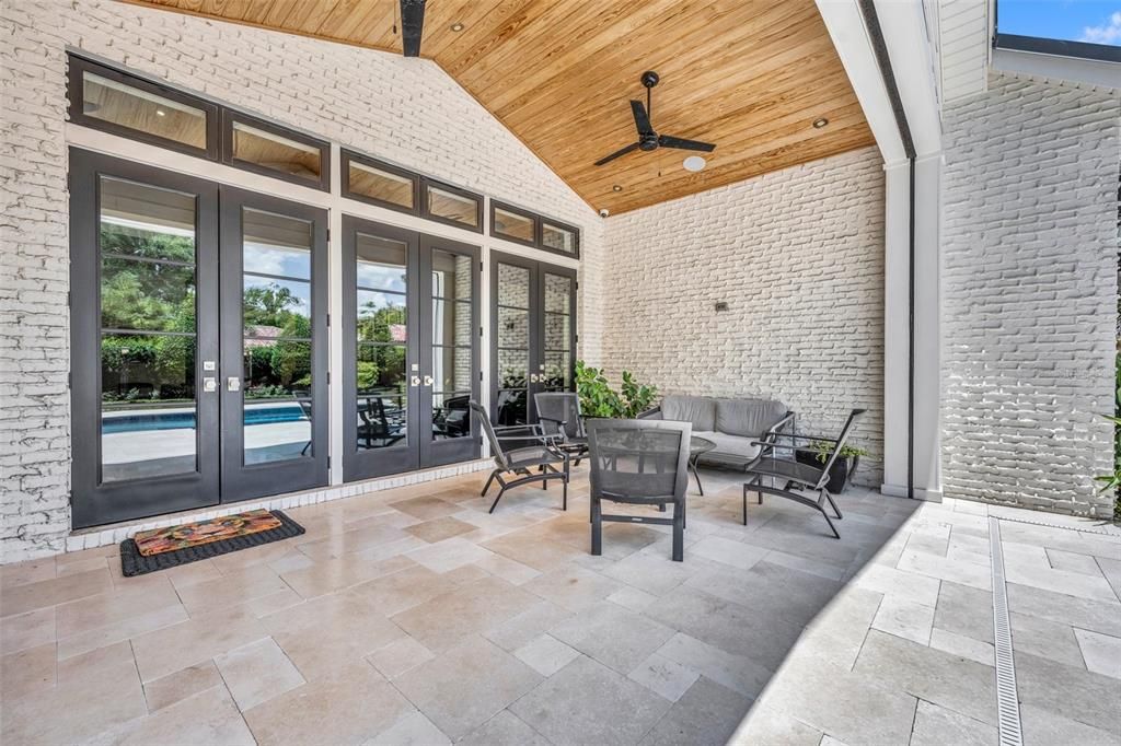 Spacious covered patio with remote screens