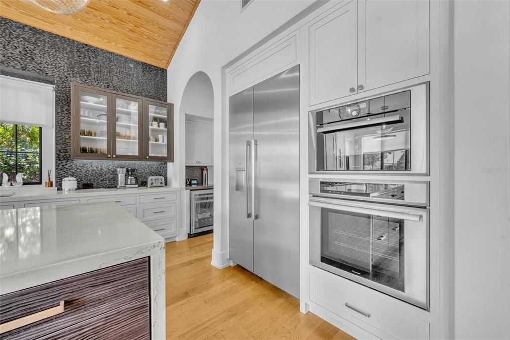 Designer backsplash goes all the way to the ceiling