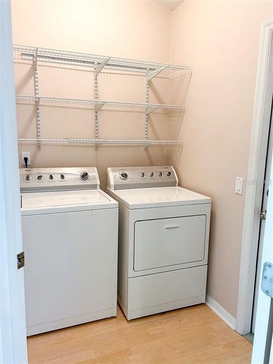 Laundry room with shelves