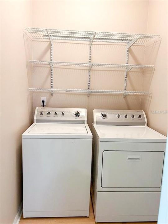 Laundry room with shelves