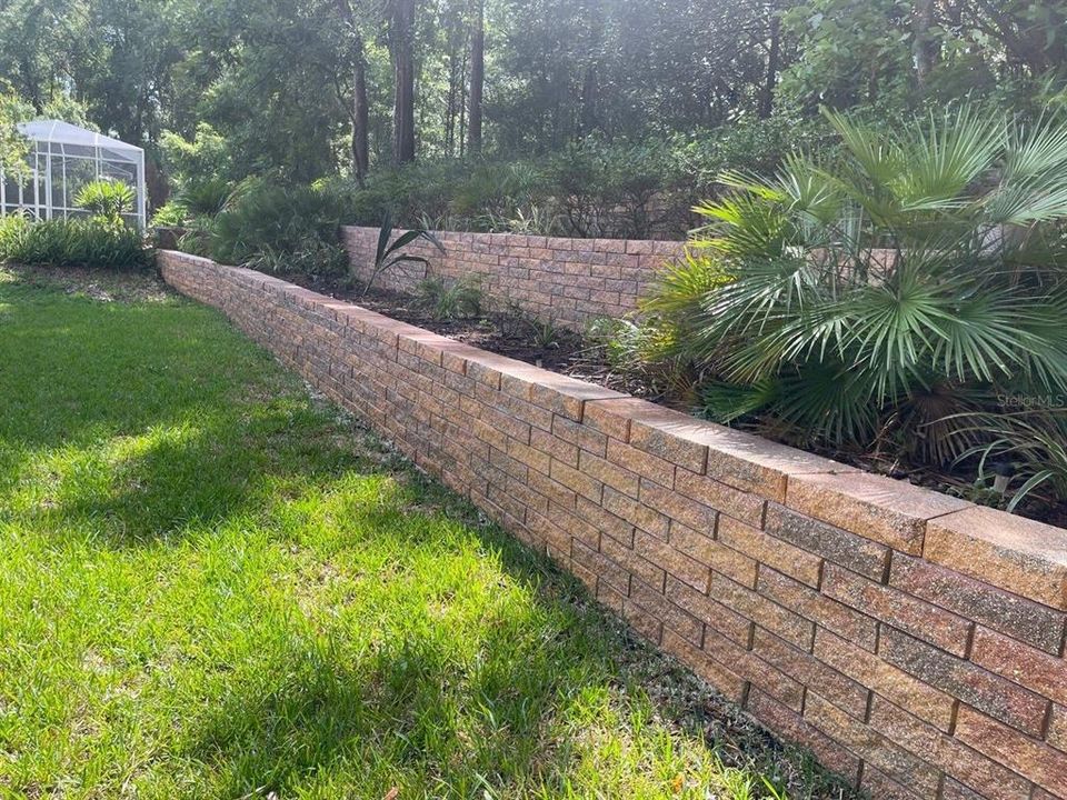 Backyard landscaped retaining wall
