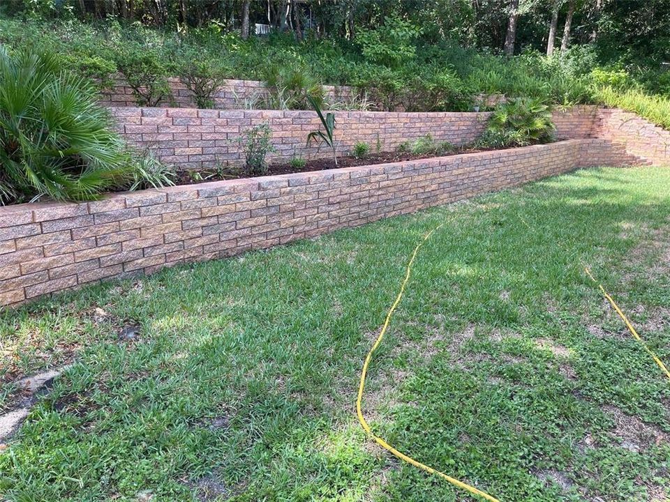 Backyard landscaped retaining wall