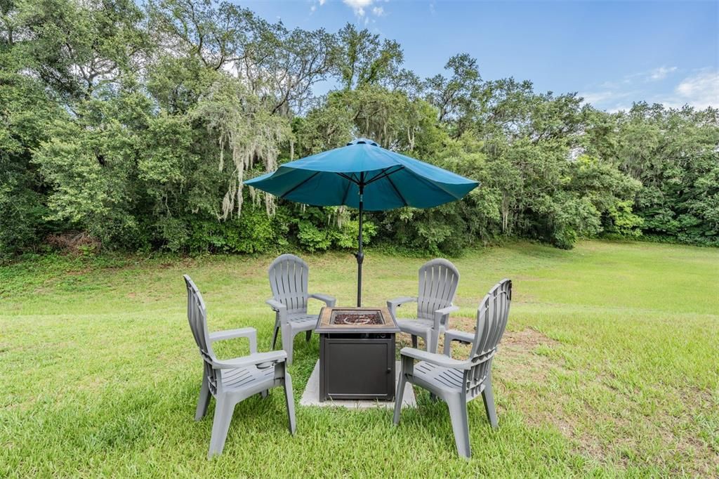 Relax by the Firepit in your private backyard oasis!