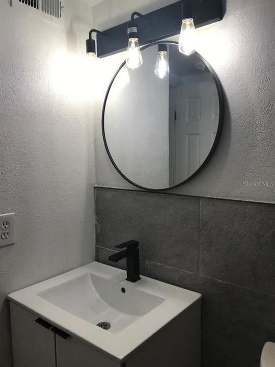 Mirror and new cabinets in the bathroom