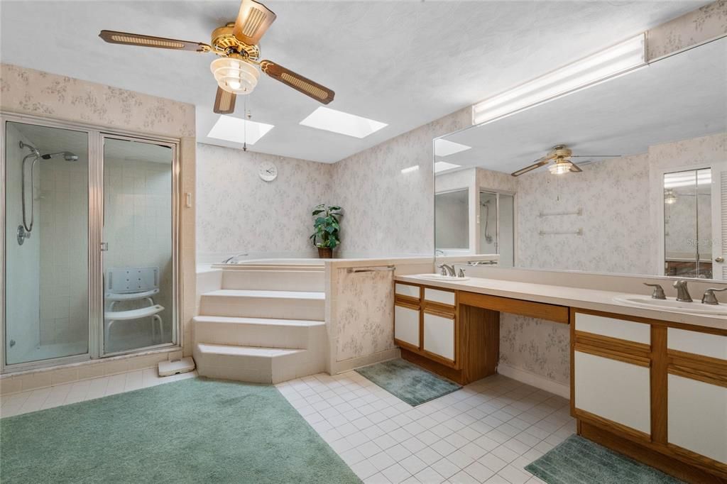 En suite bathroom with Garden tub and wakl in shower