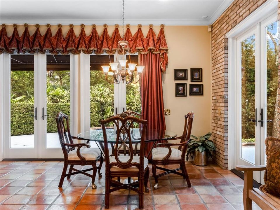 Family room additional dining area overlooking private backyard and pool area.