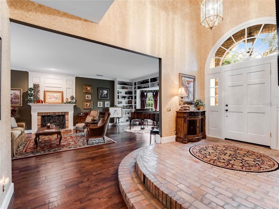 Entry of the home facing the living room and downstairs primary suite.