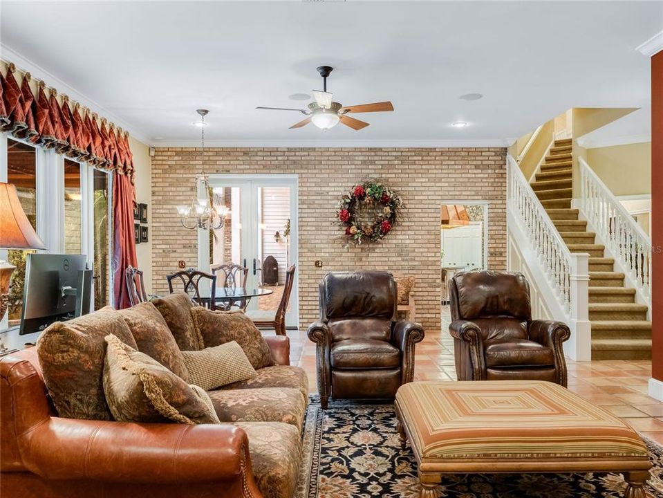 Family room overlooking the private backyard and pool area.