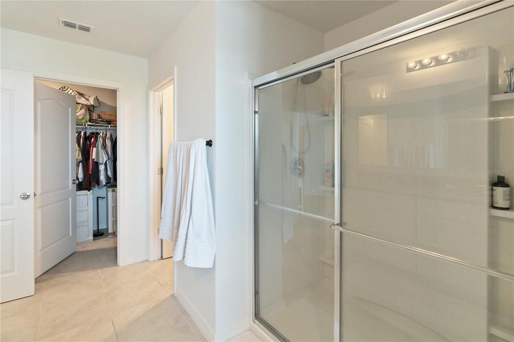 PRIMARY BATHROOM AND PRIMARY WALK-IN CLOSET