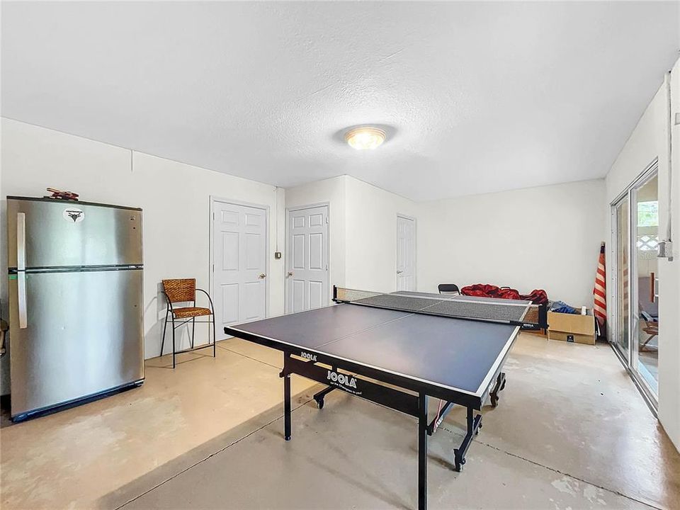 Ground level recreation room with refrigerator