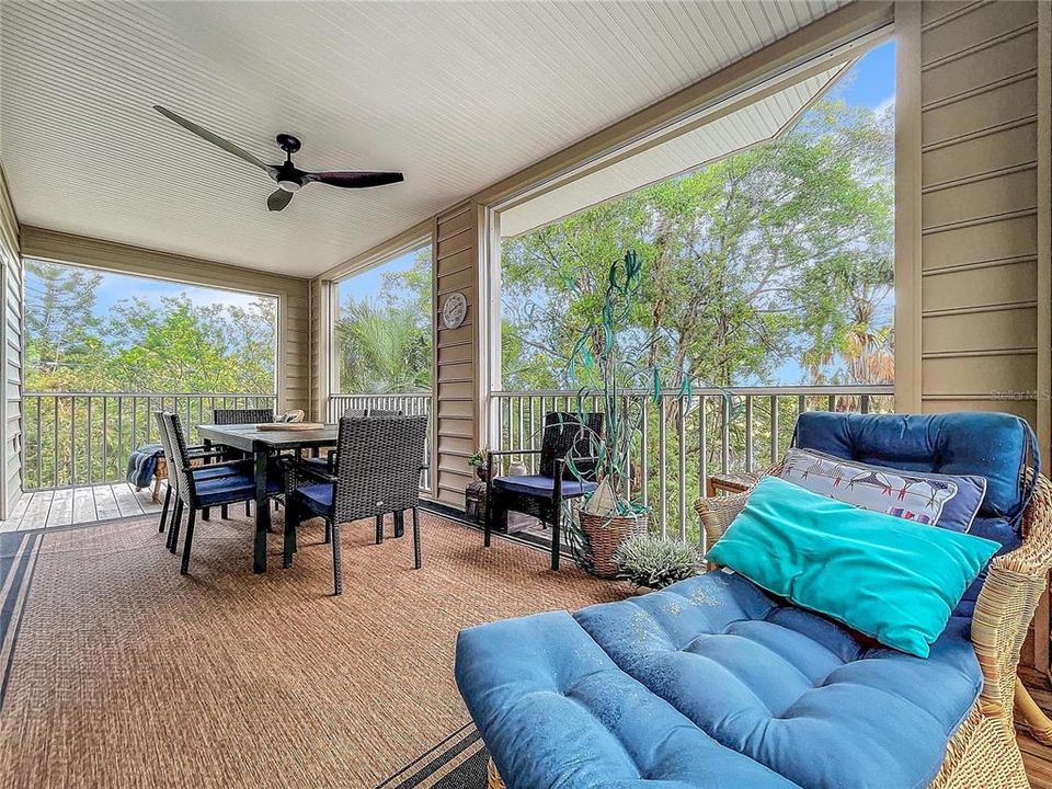 Large 24 x 10 screened lanai with stairwell to the backyard and covered patio below