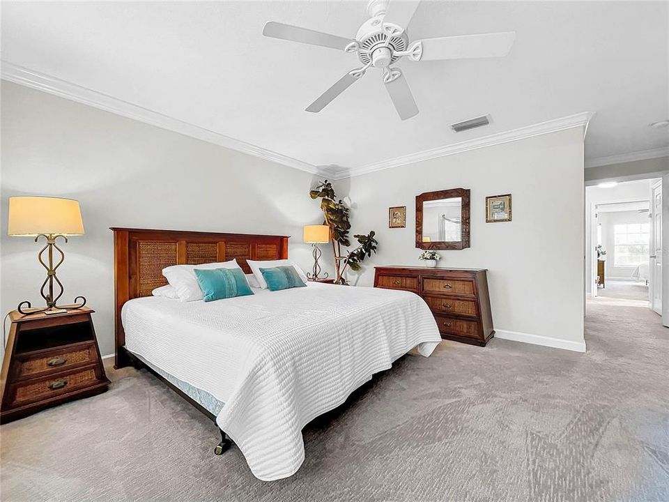 Primary bedroom with walk in closet and en-suite bathroom