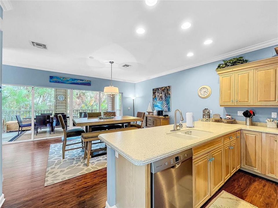 Lots of light int this home with sliders that run across the entire back side of the home with a screened lanai just beyond.