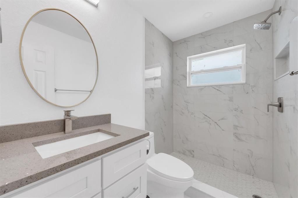 Bathroom on hallway, adjacent to bedroom #2