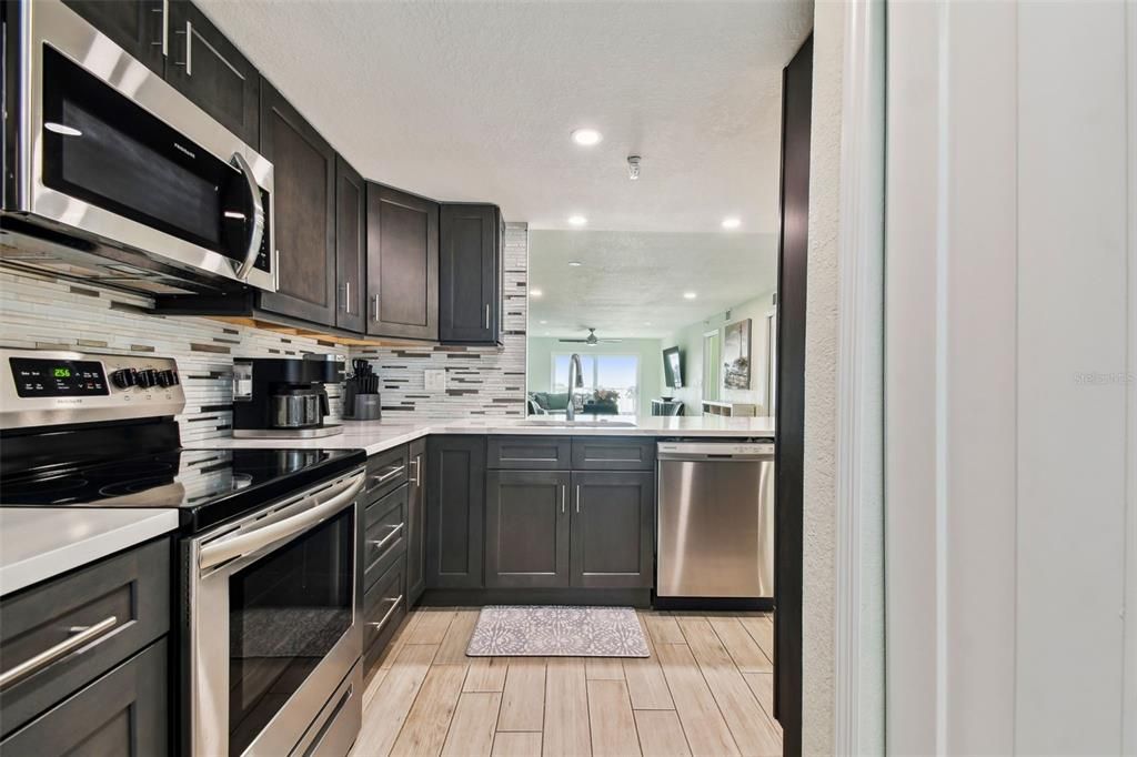 The kitchen features SS appliances and all the additional comforts of home