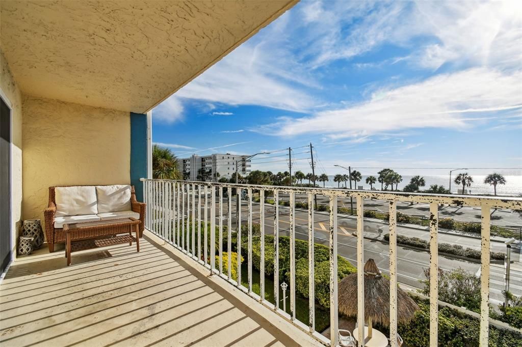 The wide balcony offers 25' of beachfront views. Plenty of room to lounge, dine and take in the scenery.