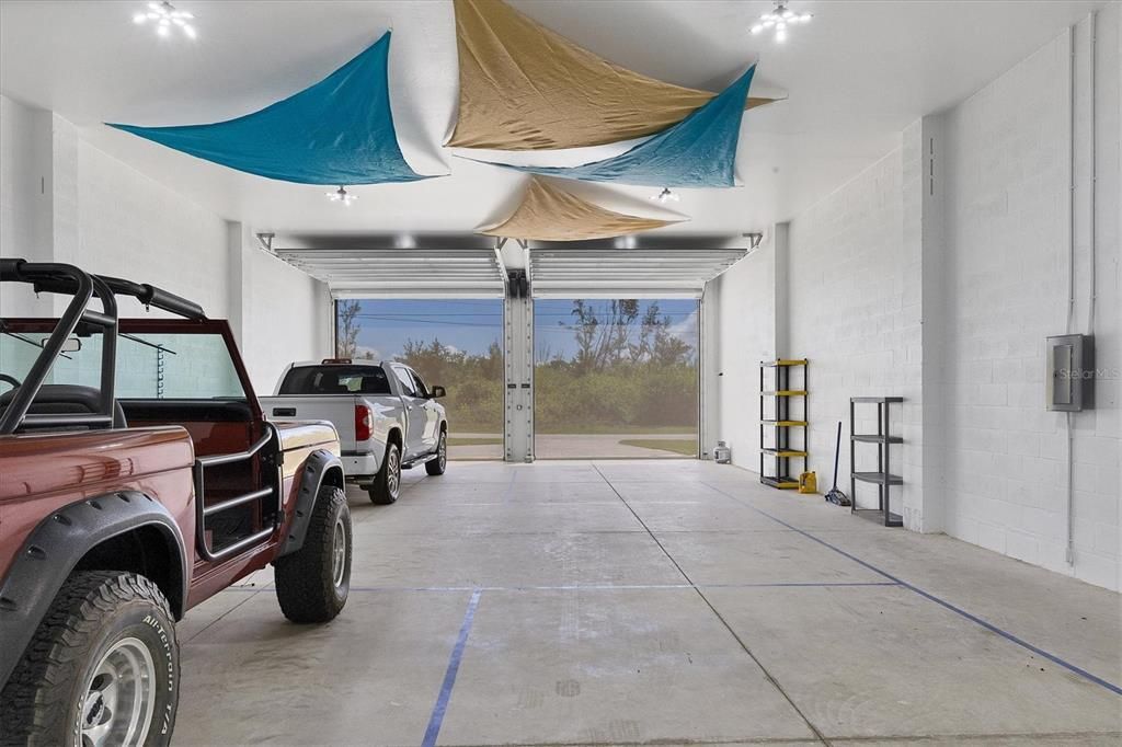 Spacious 30x60 Detached Garage with Oversized Overhead Doors, Screens, and Pickleball Court