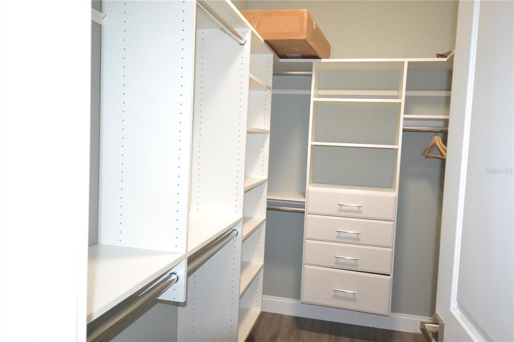 Gigantic walk in closet with shelves & drawers