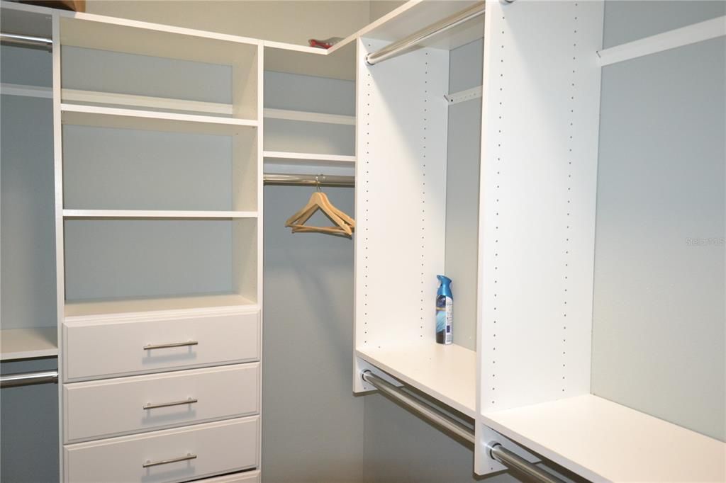 Gigantic walk in closet with shelves & drawers