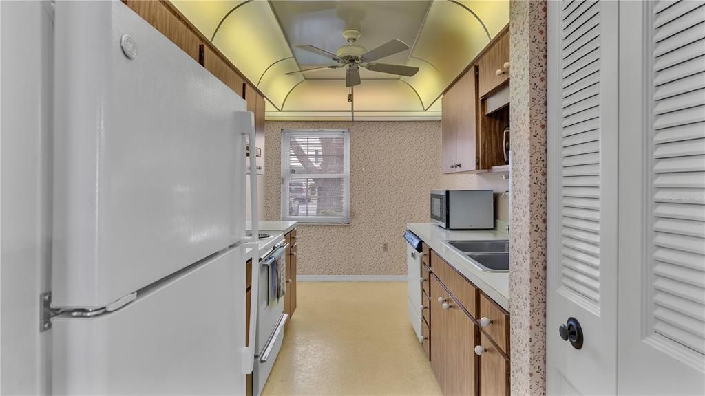 Galley Kitchen with window for natural lighting.