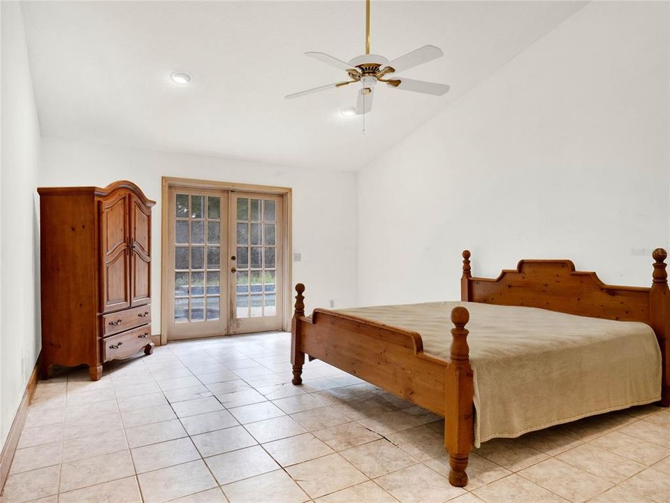 Primary bedroom with sliders to lanai