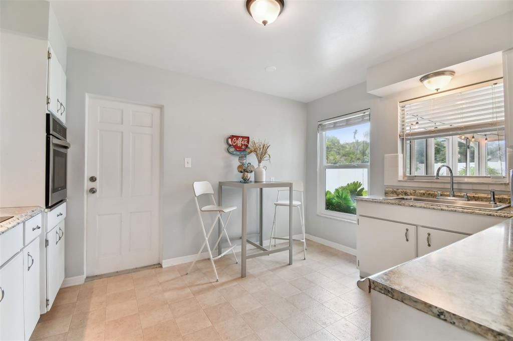 Door leads to garage and separate entrance to the air-conditioned laundry room