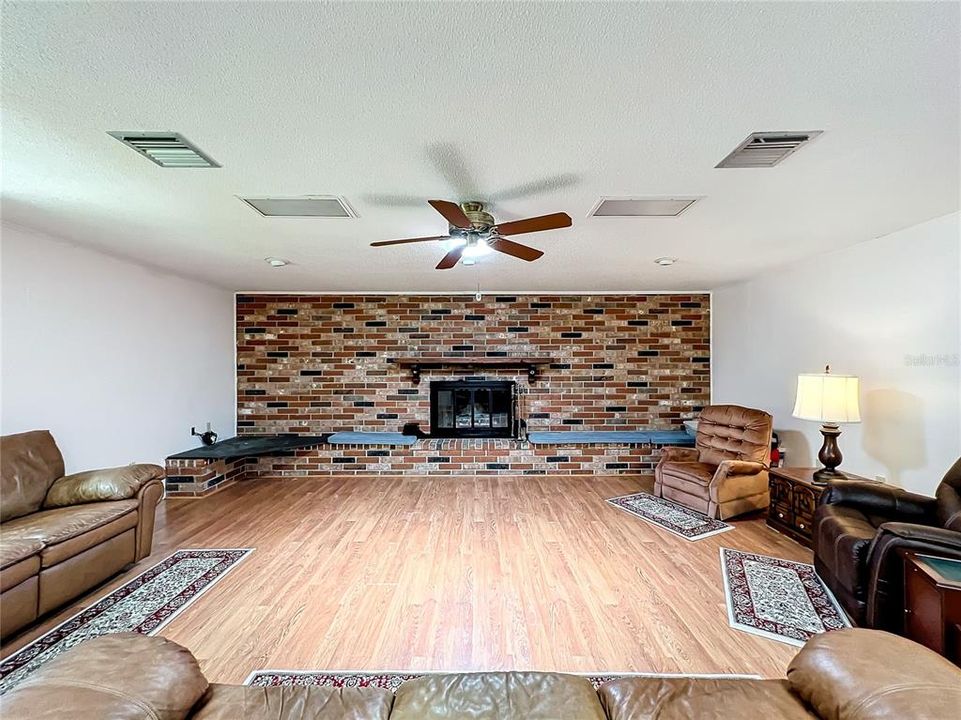 Custom brick fireplace with hidden storage!