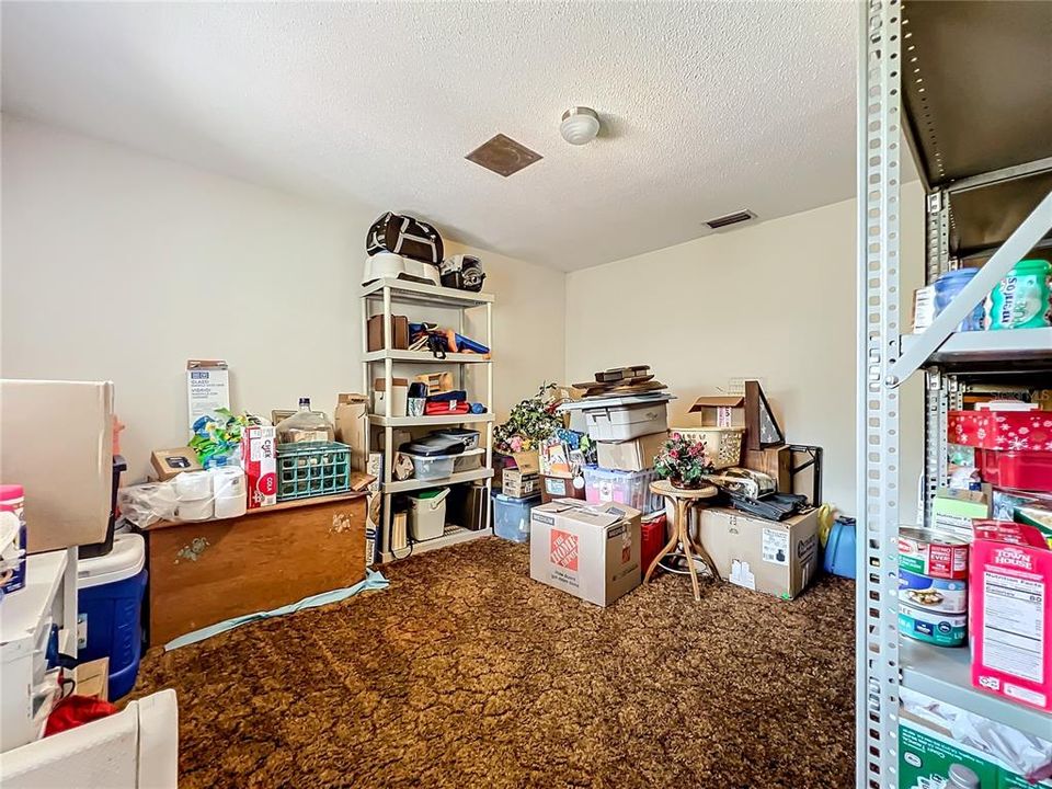 Potential walk-in pantry or dining storage with space-saving pocket door!