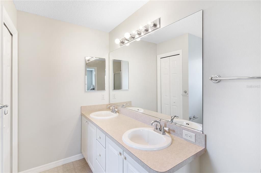 Primary Bathroom with double vanity and shower