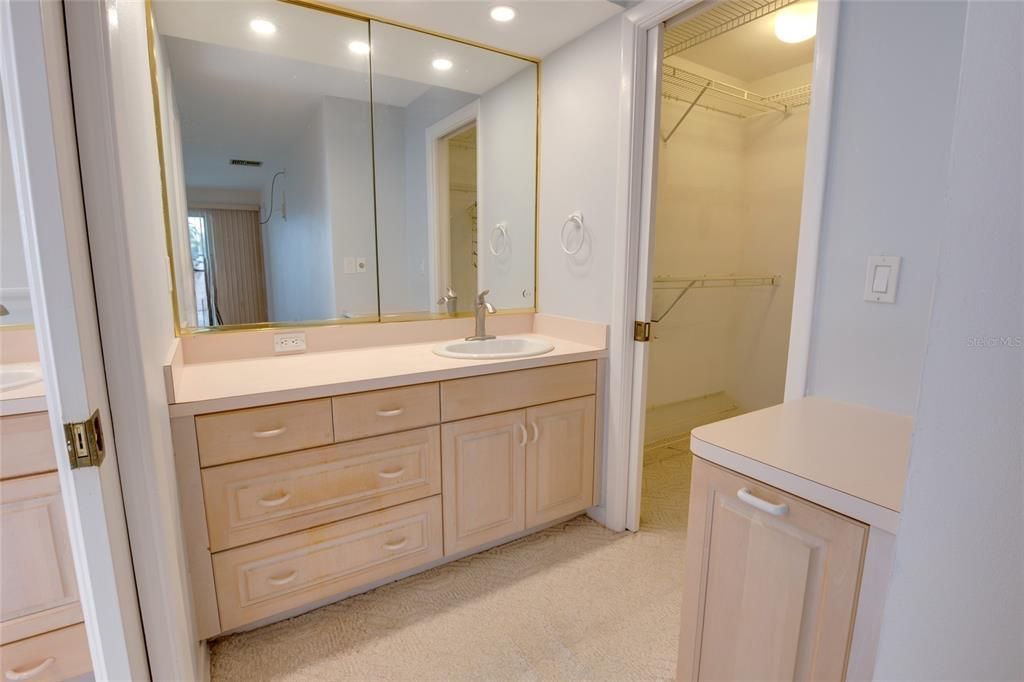 Primary Bedroom's Ensuite Bath with Glass Door to Private Garden Area