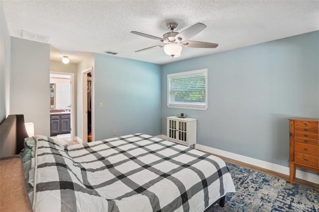 Primary bedroom with walk-in closets and ensuite bathroom