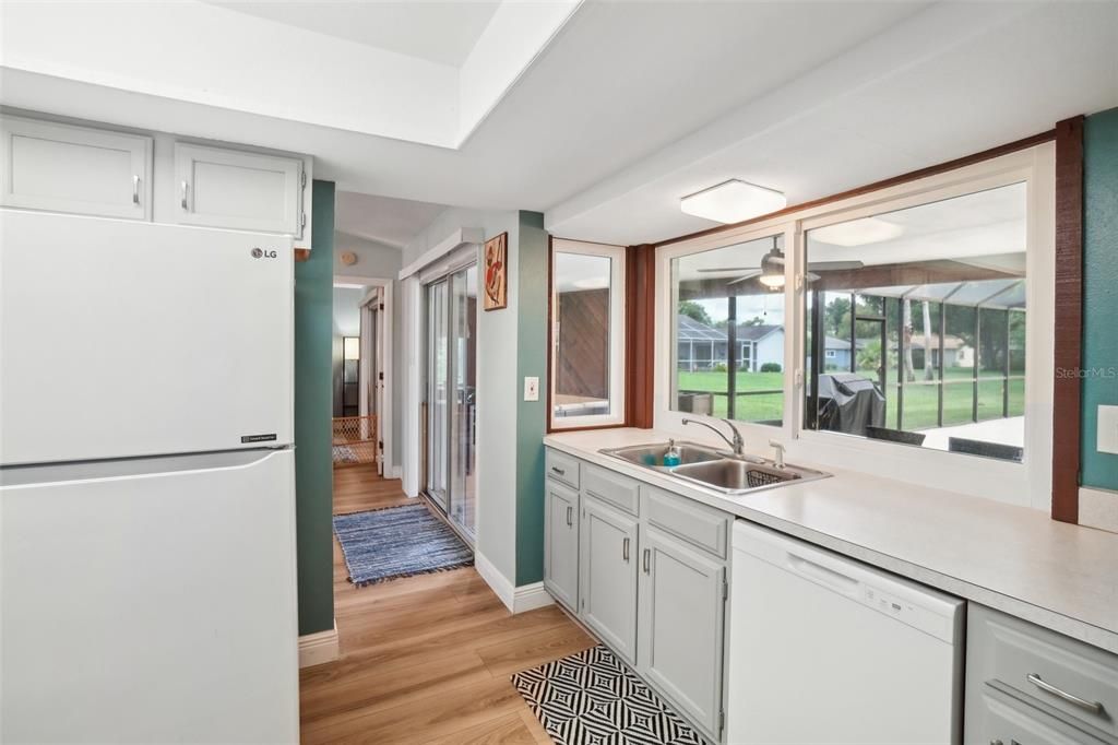 Kitchen with windows to the patio and new dishwasher