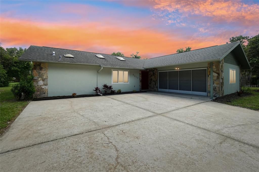 Virtual twilight of home- 2 car garage and screen in garage.