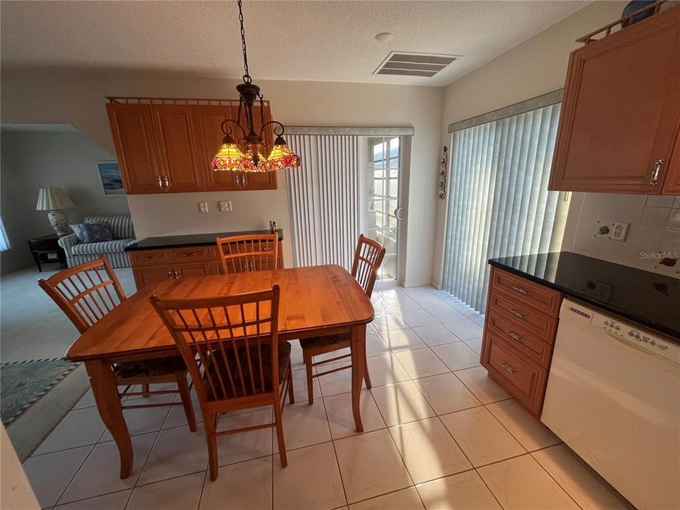 Kitchen view toward the front door and living room