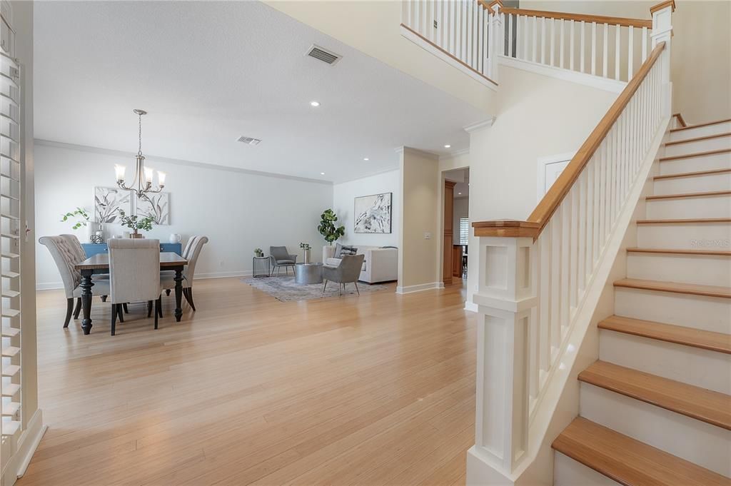 Expansive open concept design combining formal dining and living area