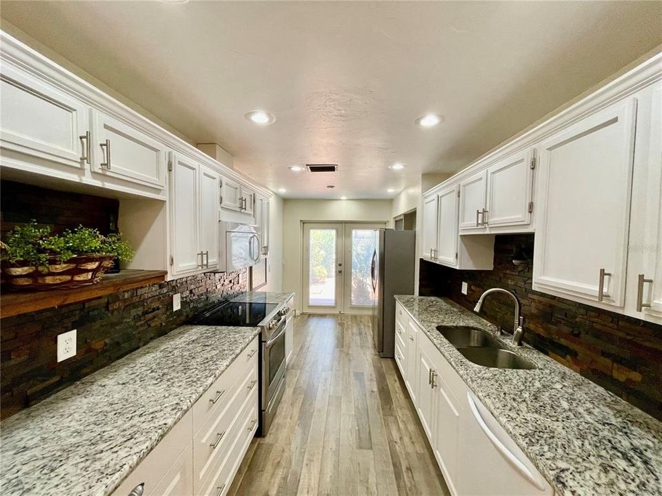 View of the nice bright white kitchen