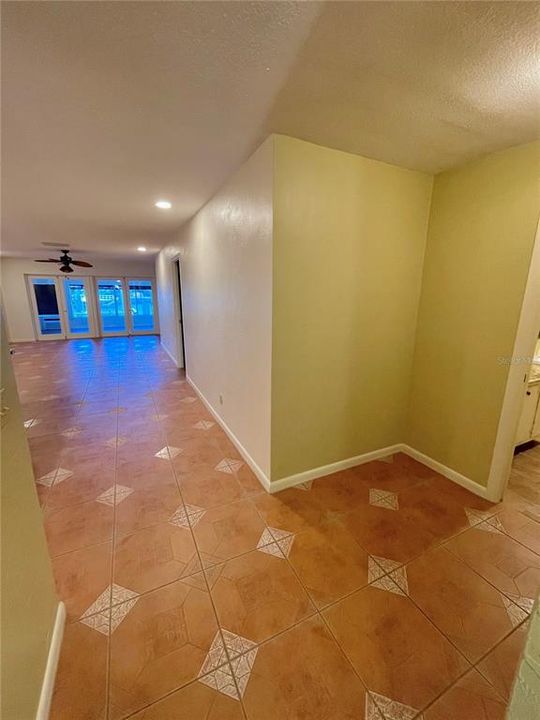 Beginning into hallway this corner alcove is great for a storage area or small desk.