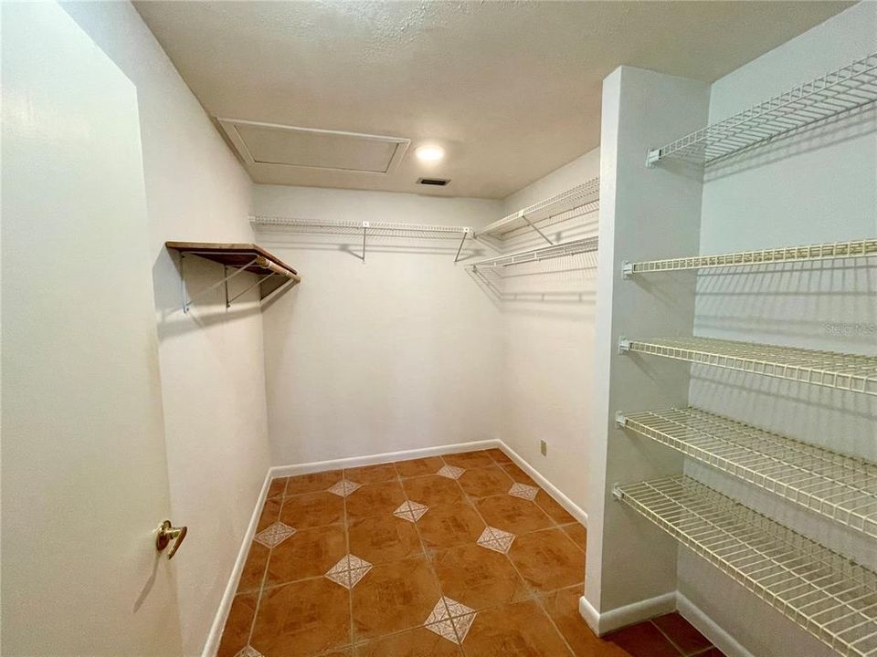 Large Master Closet with tons of hanging & shelf storage