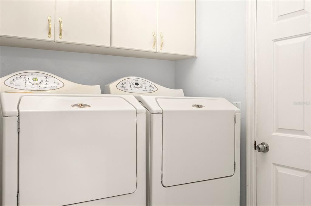 Laundry room between foyer and garage