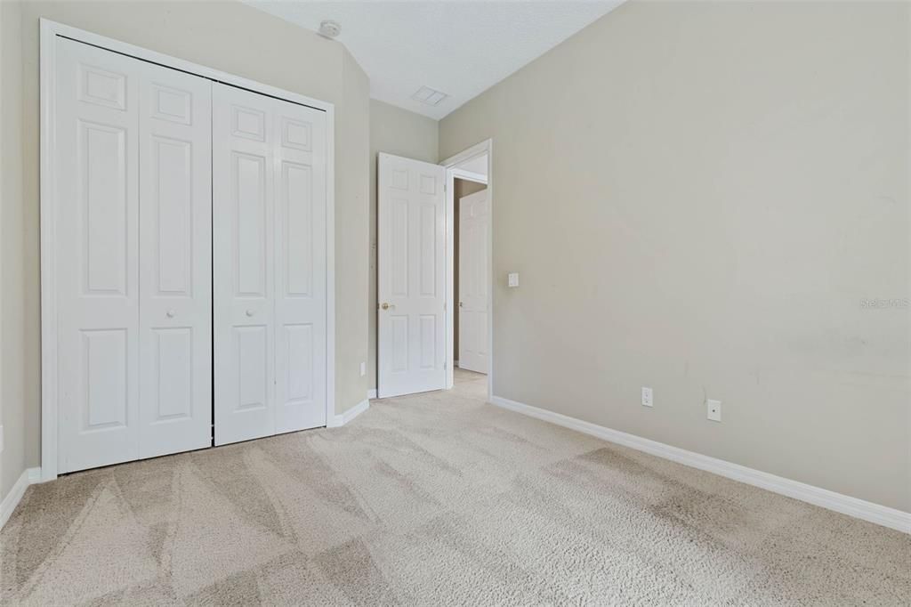 Dedicated laundry room with sink and a window