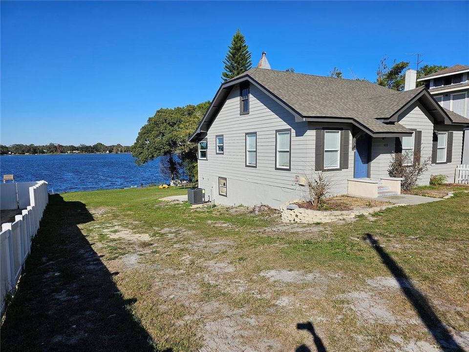 Home from the front/side with lake view to the back.