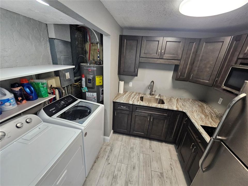 Downstairs kitchen/laundry room.