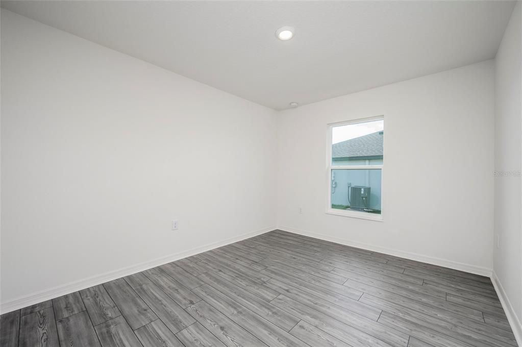 Primary Bedroom features a Vaulted Ceiling