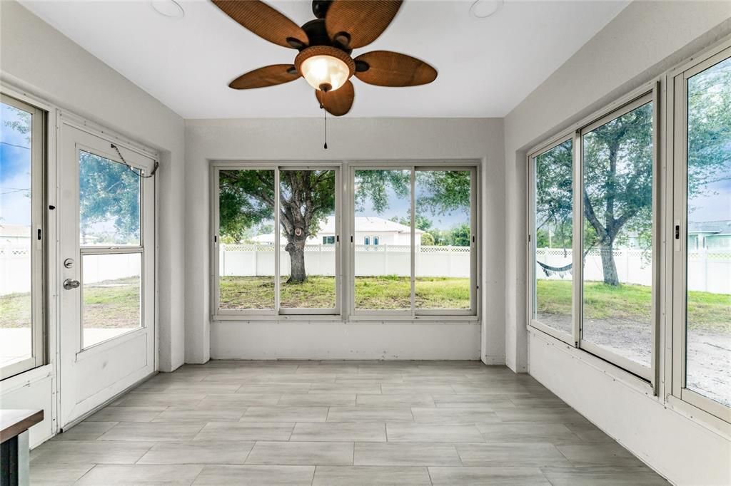 The Florida room with porcelain tile throughout