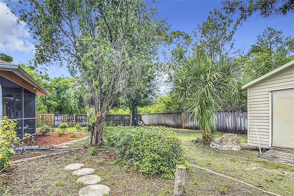 Fenced backyard with 2 sheds