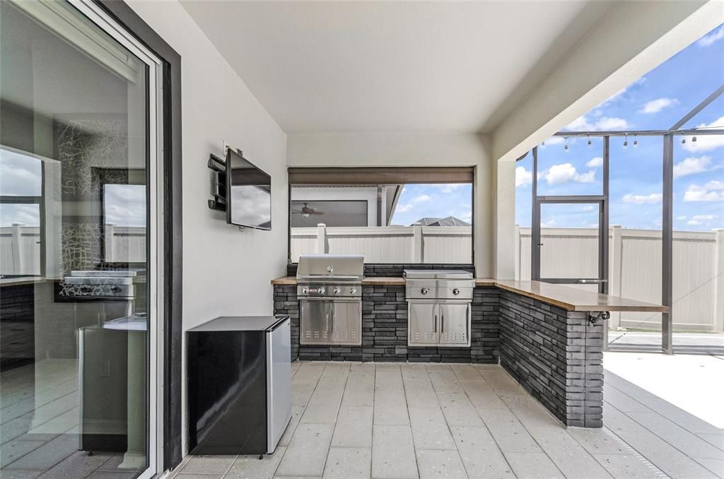 Outdoor Kitchen, Pool and Seating Areas