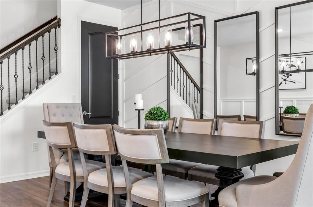 Formal Dining area with extra storage space below the stairs.